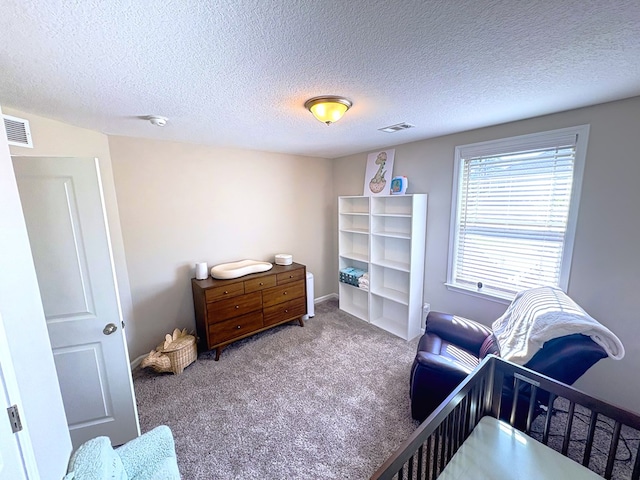 8840 Sullivans Dr, Midland, GA 31820 - carpeted bedroom with a textured ceiling