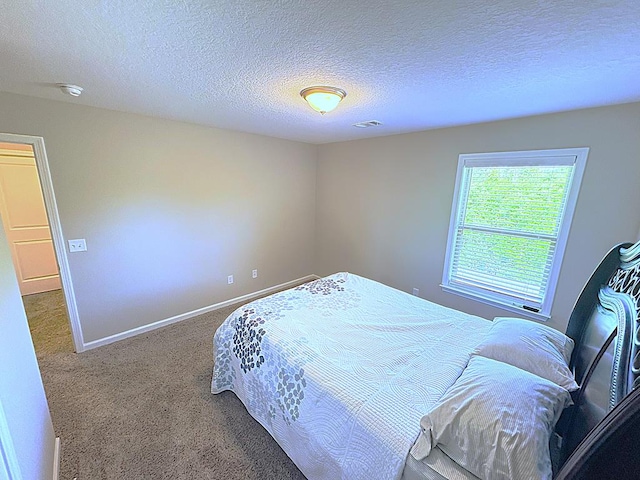 8840 Sullivans Dr, Midland, GA 31820 - carpeted bedroom with a textured ceiling and baseboards