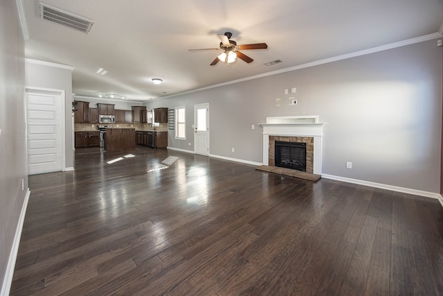 unfurnished living room with a fireplace, ornamental molding, dark hardwood / wood-style floors, and ceiling fan