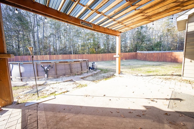 view of patio with a fenced in pool