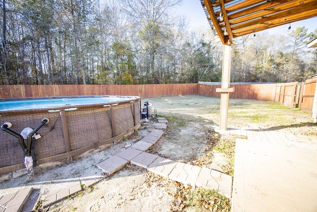 exterior space with a fenced in pool