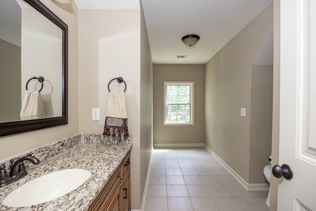 3450 Mckee Rd, Upatoi, GA 31829 - bathroom featuring vanity, tile patterned flooring, baseboards, and toilet