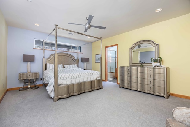 carpeted bedroom featuring ensuite bathroom and ceiling fan