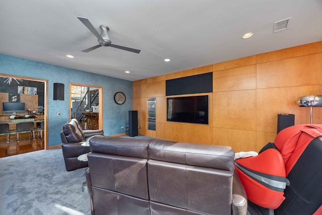 living room with carpet flooring and ceiling fan