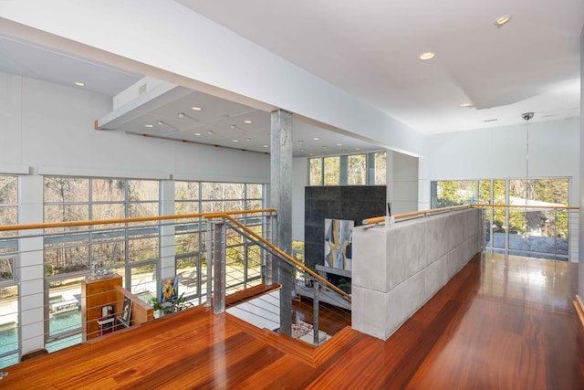 living room with a healthy amount of sunlight and hardwood / wood-style flooring