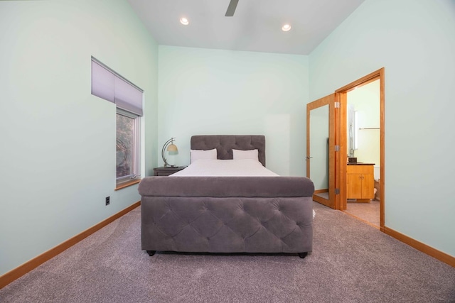 bedroom featuring carpet flooring, ceiling fan, and connected bathroom