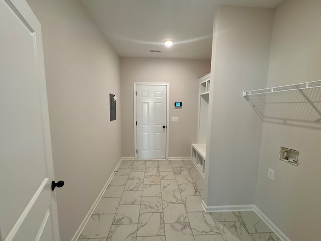 clothes washing area with electric dryer hookup and washer hookup