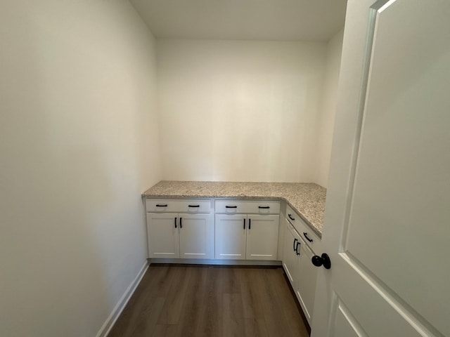 laundry area featuring dark wood-type flooring