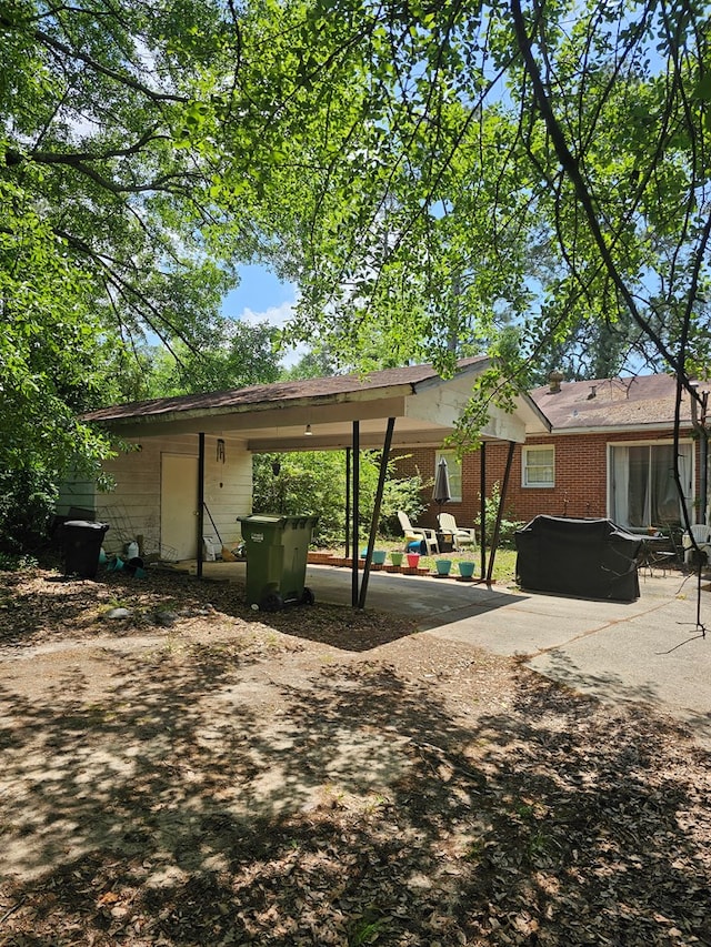 view of parking / parking lot with a carport
