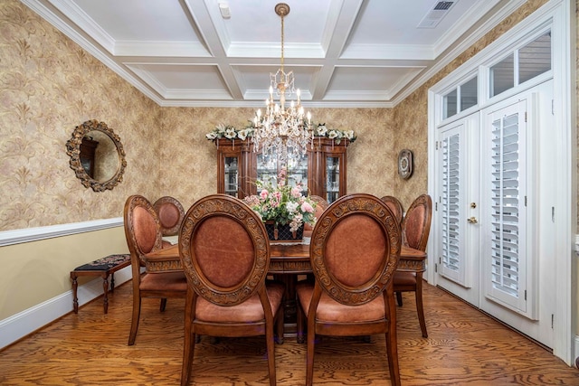 dining area featuring an inviting chandelier, french doors, hardwood / wood-style flooring, ornamental molding, and beam ceiling