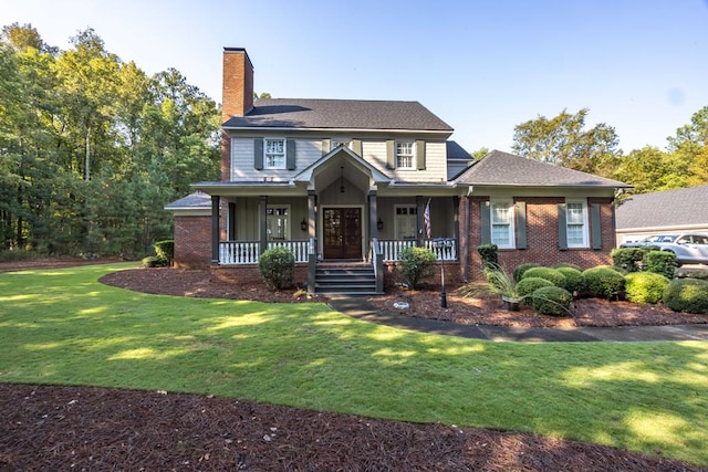 view of front facade with a front yard and a porch