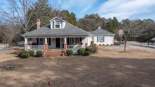 1011 Bass Rd, Macon, GA 31210 - view of front of home featuring fence, a porch, roof with shingles, a chimney, and driveway