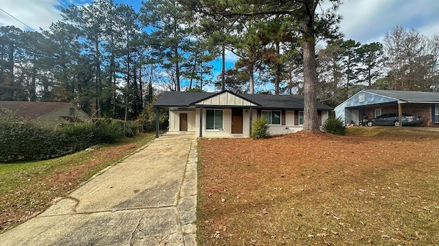 ranch-style home with a carport