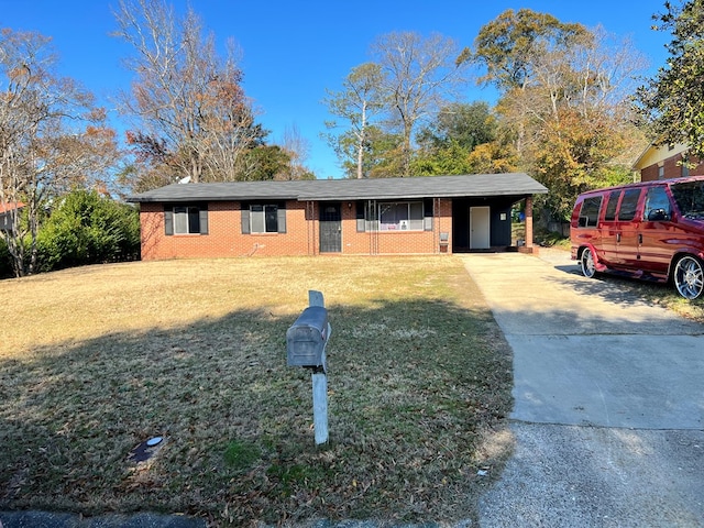 single story home with a front yard and a carport