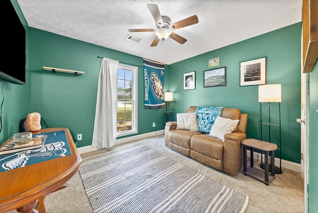 4607 N Tillery Dr, Phenix City, AL 36870 - carpeted living area featuring ceiling fan and a textured ceiling