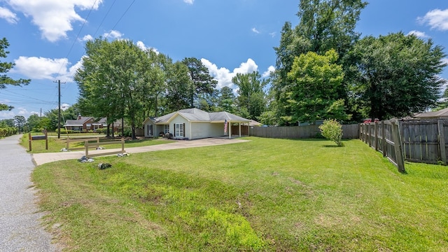 4607 N Tillery Dr, Phenix City, AL 36870 - view of yard featuring driveway and an attached carport