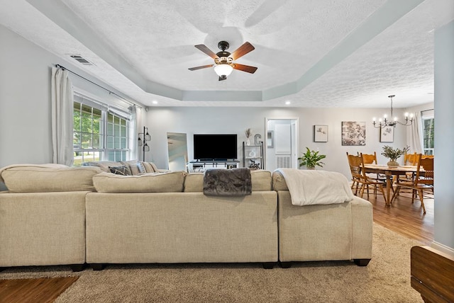 4607 N Tillery Dr, Phenix City, AL 36870 - living area featuring a chandelier, a textured ceiling, wood finished floors, plenty of natural light, and a ceiling fan