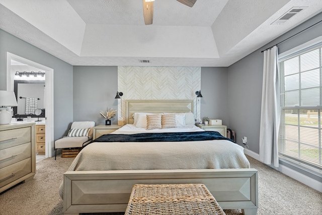 4607 N Tillery Dr, Phenix City, AL 36870 - bedroom with a raised ceiling, light carpet, and multiple windows