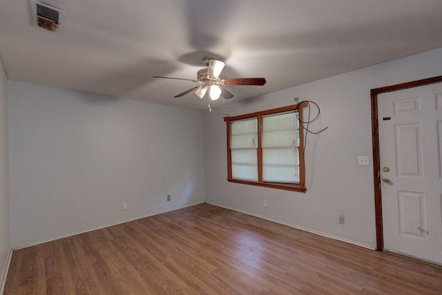 unfurnished room featuring ceiling fan and light wood-type flooring