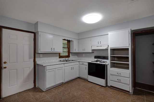 kitchen with a textured ceiling, white cabinetry, white range with electric stovetop, and sink