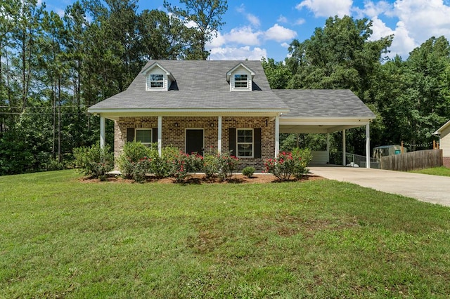 344 Lee Road 2040, Phenix City, AL 36870 - cape cod-style house featuring brick siding, concrete driveway, and a carport