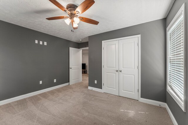 344 Lee Road 2040, Phenix City, AL 36870 - unfurnished bedroom with carpet, a textured ceiling, a closet, and ceiling fan