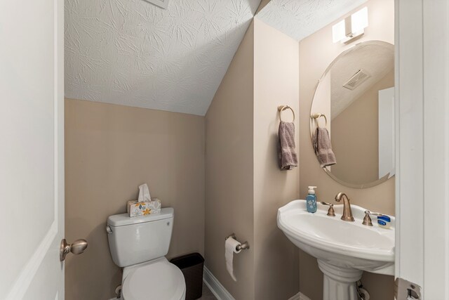 344 Lee Road 2040, Phenix City, AL 36870 - half bathroom featuring toilet and lofted ceiling