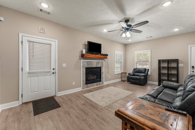 344 Lee Road 2040, Phenix City, AL 36870 - living area with ceiling fan, a fireplace, light wood-style flooring, a textured ceiling, and recessed lighting
