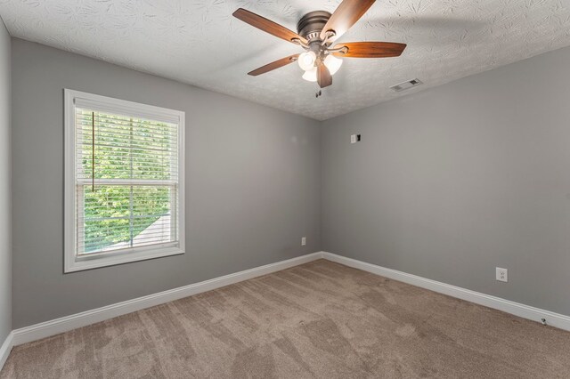 344 Lee Road 2040, Phenix City, AL 36870 - spare room featuring a ceiling fan, carpet flooring, and a textured ceiling