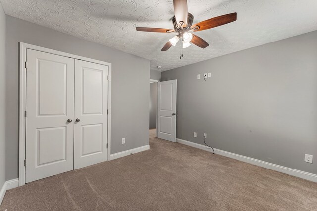 344 Lee Road 2040, Phenix City, AL 36870 - unfurnished bedroom featuring carpet, a closet, a textured ceiling, and ceiling fan