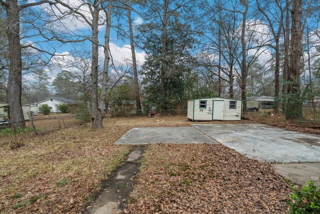 1474 Brewer Ave, Columbus, GA 31903 - view of yard with a storage shed and a patio area