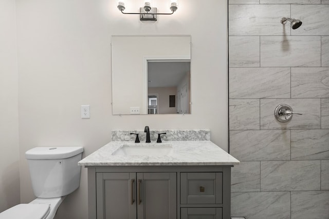 1474 Brewer Ave, Columbus, GA 31903 - bathroom featuring a tile shower, vanity, and toilet
