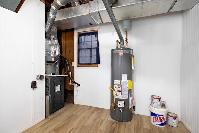 utility room featuring water heater