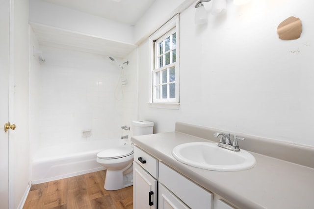 full bathroom with vanity, bathing tub / shower combination, toilet, and wood finished floors