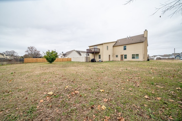 rear view of house with a lawn