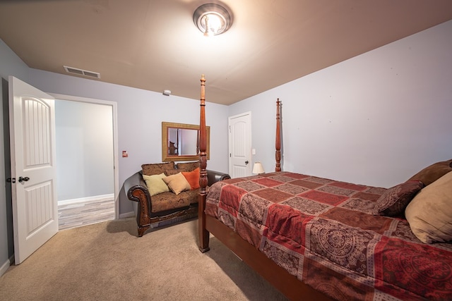 bedroom with light colored carpet