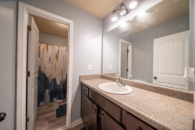 bathroom featuring wood-type flooring and vanity