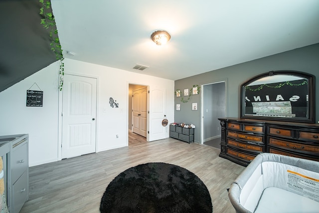 bedroom with light hardwood / wood-style floors