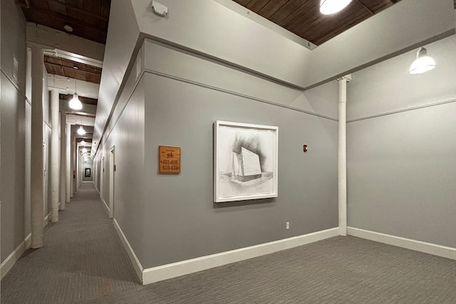 1201 Front Ave Unit 419, Columbus, GA 31901 - corridor with carpet floors, baseboards, and wood ceiling