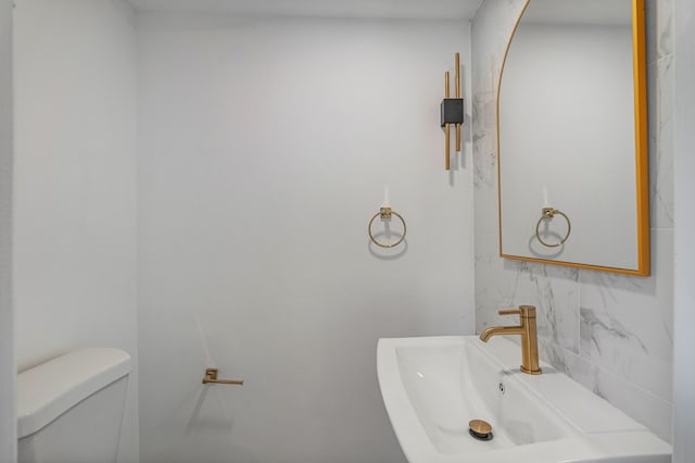 4975 Glacier Dr, Columbus, GA 31907 - bathroom featuring toilet and backsplash
