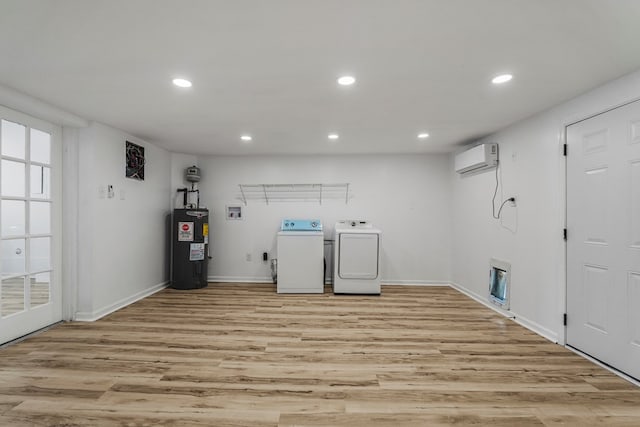 4975 Glacier Dr, Columbus, GA 31907 - washroom with independent washer and dryer, electric water heater, a wall mounted AC, recessed lighting, and light wood-type flooring