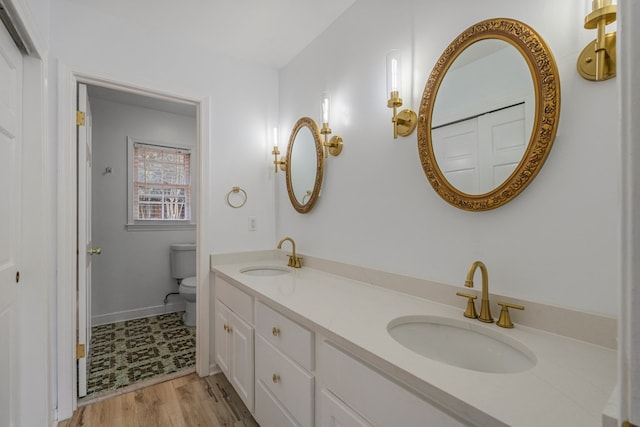 4975 Glacier Dr, Columbus, GA 31907 - bathroom with double vanity and wood finished floors