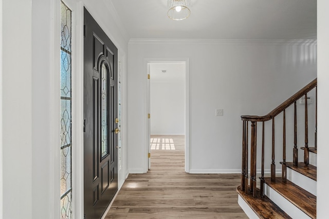 4975 Glacier Dr, Columbus, GA 31907 - entryway with wood finished floors, healthy amount of natural light, stairs, and ornamental molding