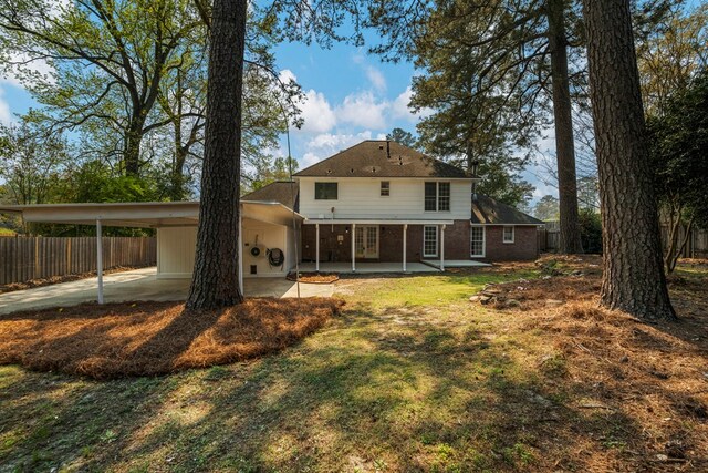 4975 Glacier Dr, Columbus, GA 31907 - back of property with brick siding and an attached carport