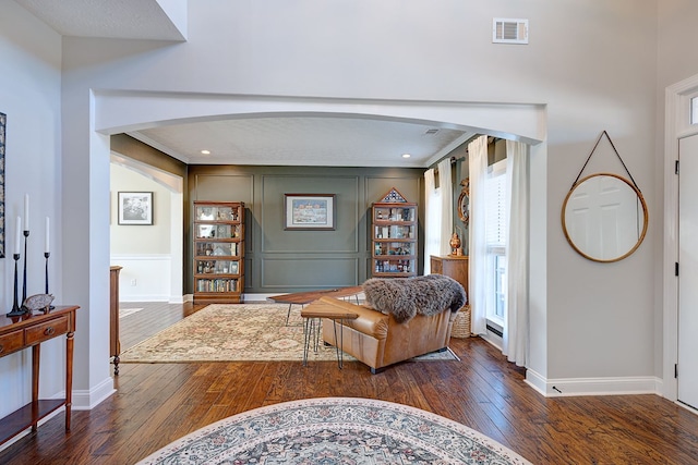 living room with dark hardwood / wood-style floors