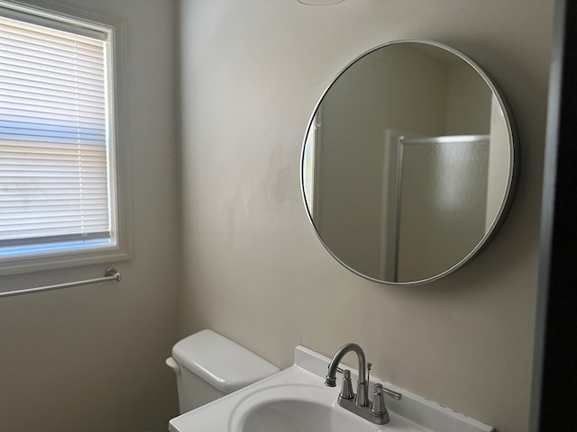 bathroom featuring toilet and a sink