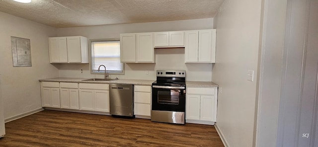 kitchen with electric panel, sink, dark wood-type flooring, stainless steel appliances, and white cabinets