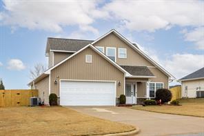 view of front of home featuring a garage and concrete driveway