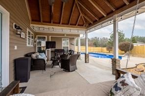 view of patio featuring a fenced in pool