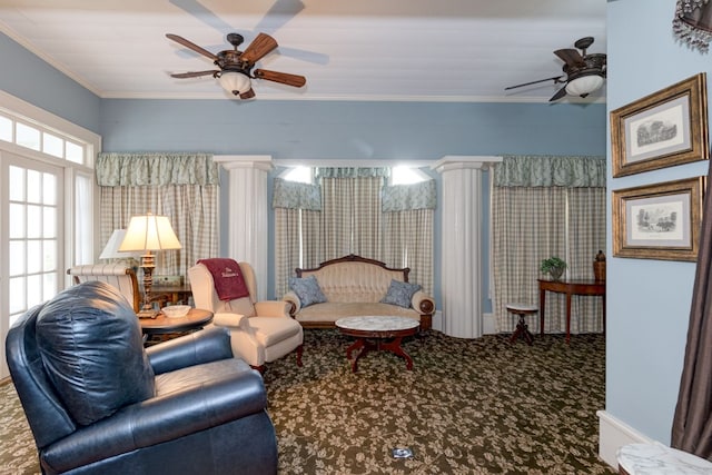 living room with decorative columns, carpet floors, and ornamental molding